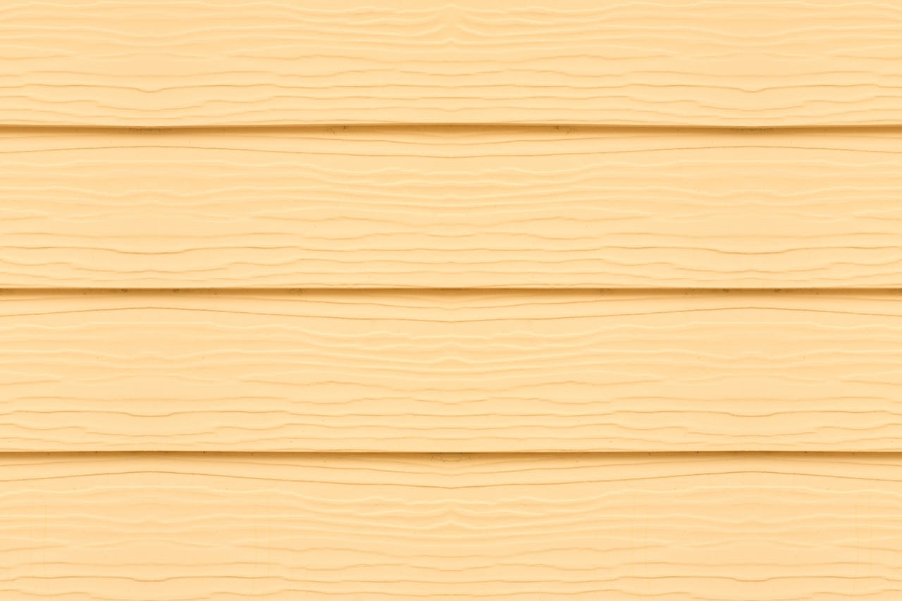 our-services-03 Detailed close-up of textured yellow wooden panels, ideal for design projects.