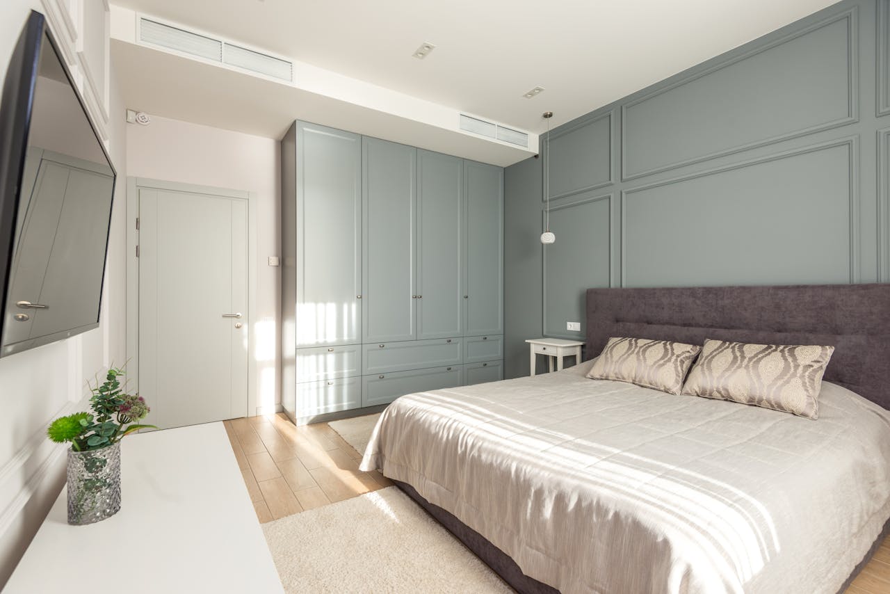 about-us-img Bright modern bedroom with minimalistic design and stylish furniture.